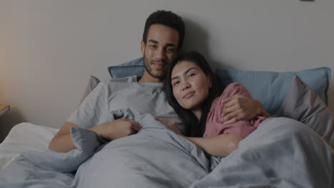 Couple Cozy in Bed