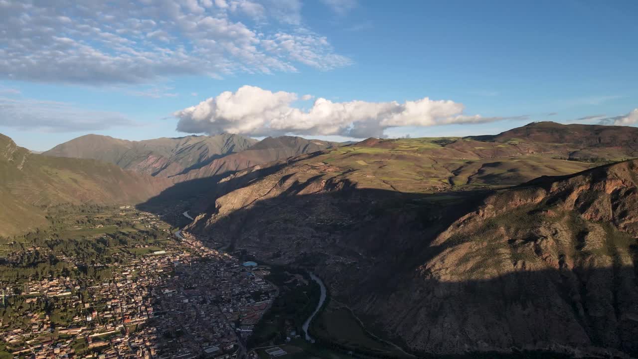 Aerial of the town and mountains of Urubamba, Sacred Valley, Cusco, Peru. Drone slow orbit