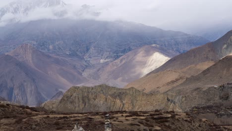 a time-lapse video of clouds moving over the rugged himalaya mountains