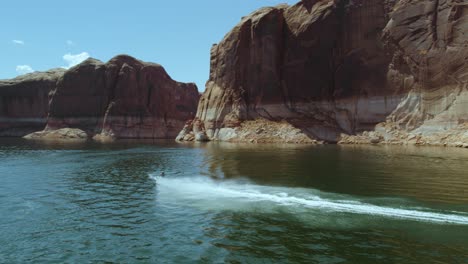 jet ski waverunner by lake powell canyon cliffs in beautiful canyon, aerial