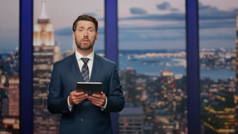 bearded anchor man talking at newscast multimedia channel close up. daily news