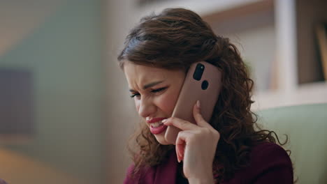 frustrated executive speaking smartphone with business partner in office closeup
