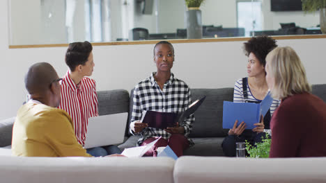 Diverse-group-of-male-and-female-business-colleagues-working-in-office