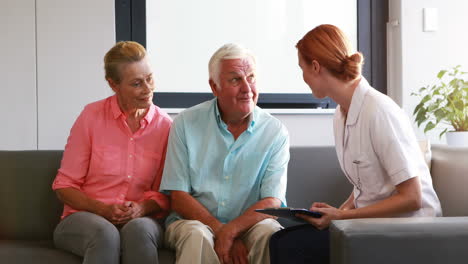 nurse have discussion with her senior patients