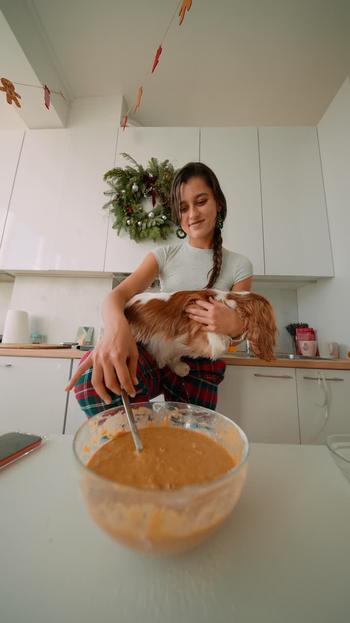 Woman Baking with Dog in Kitchen