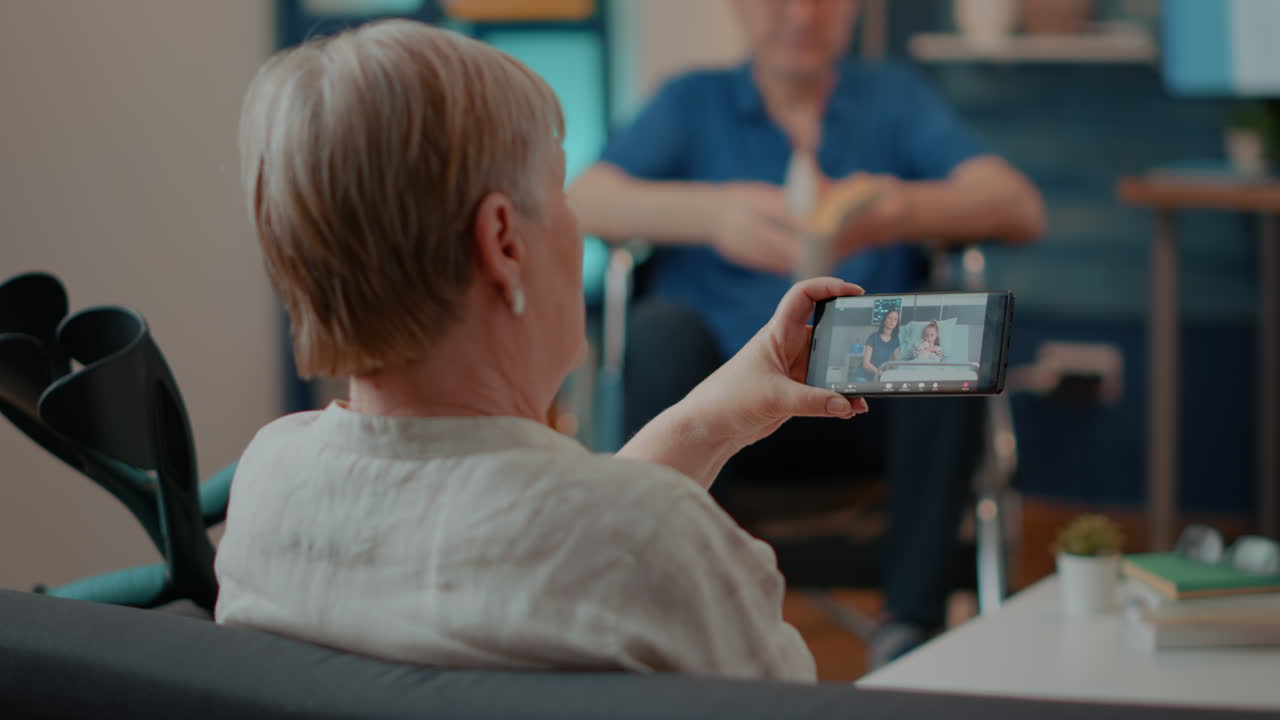 Senior Woman on Video Call with Granddaughter