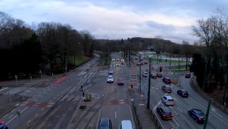 time lapse view of traffic and public transport crossing busy intersection in brussels, belgium