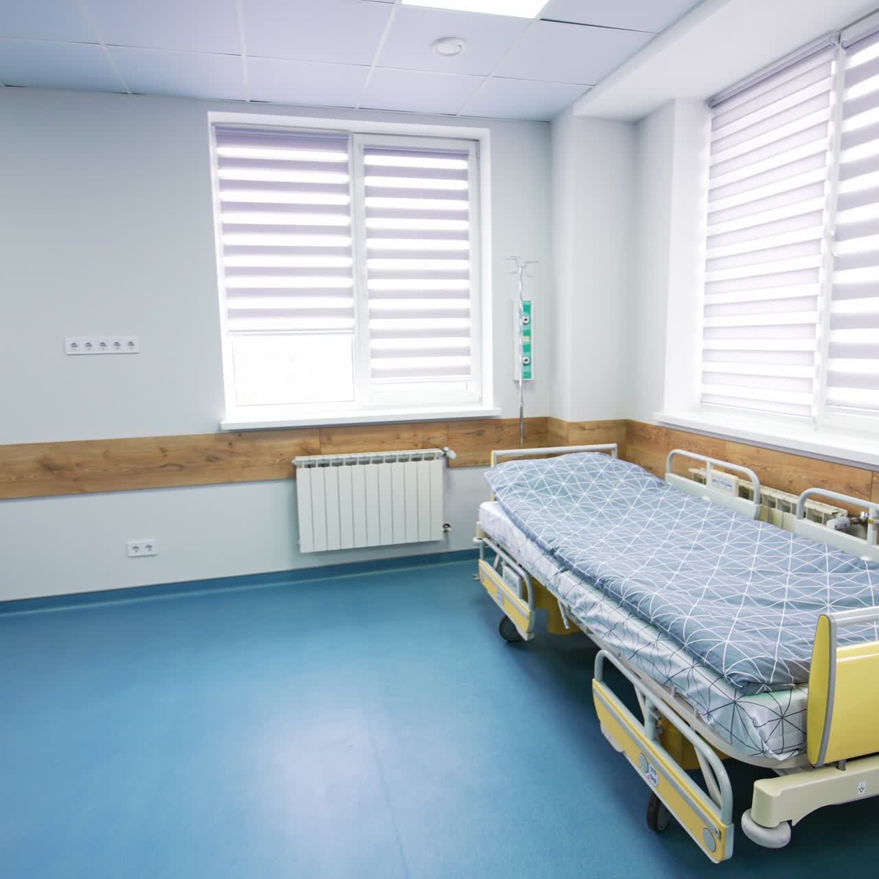 Empty ward with three beds for intensive care patients. Clean and light emergency room in modern hospital
