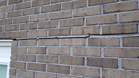 cracked brick foundation, house settling causing bricks crack