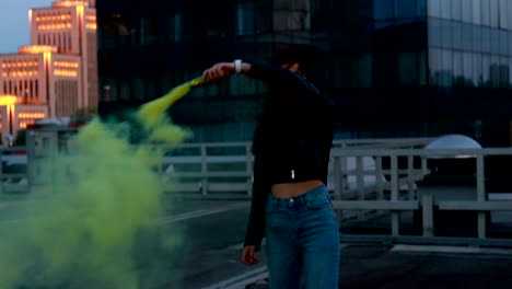 woman makes emergency flare signal. hipster girl with smoke bomb