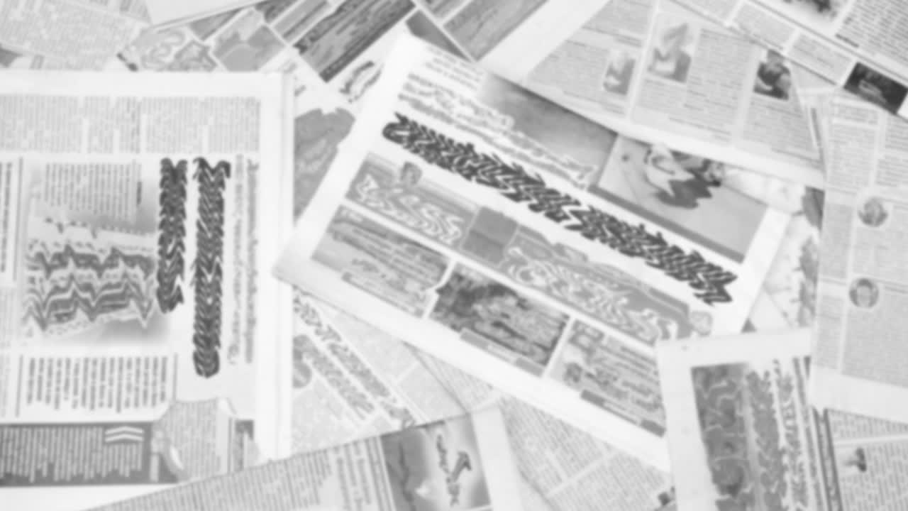 Abstract Animation of Blurred Newspaper Pages with Headlines and Articles Shown in Random Order