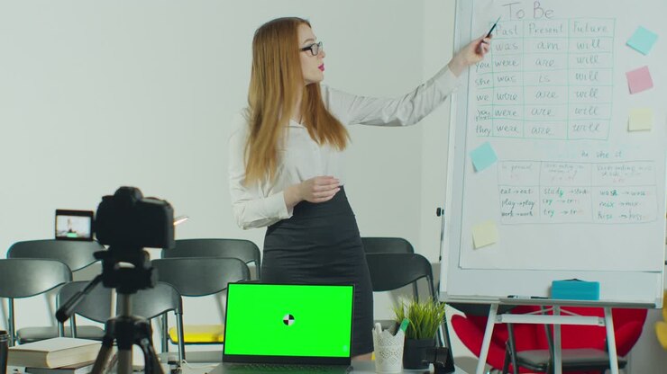 Remote education, online college lesson, distant studying concept. A teacher is explaining information during an online class. Green Screen Chroma Key Laptop for Learning.
