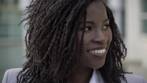 cheerful african american woman looking around