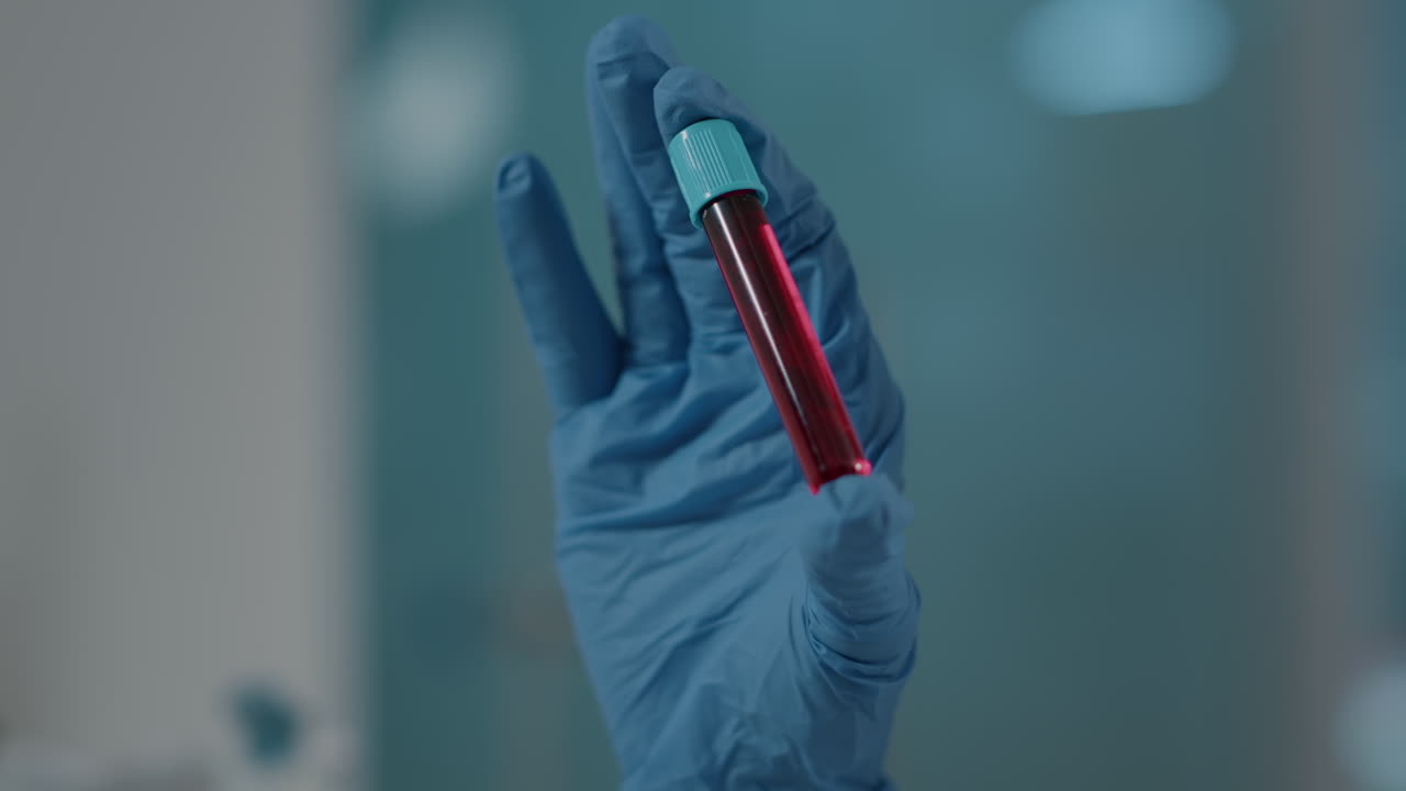 Scientist holding test tube with dna substance in laboratory