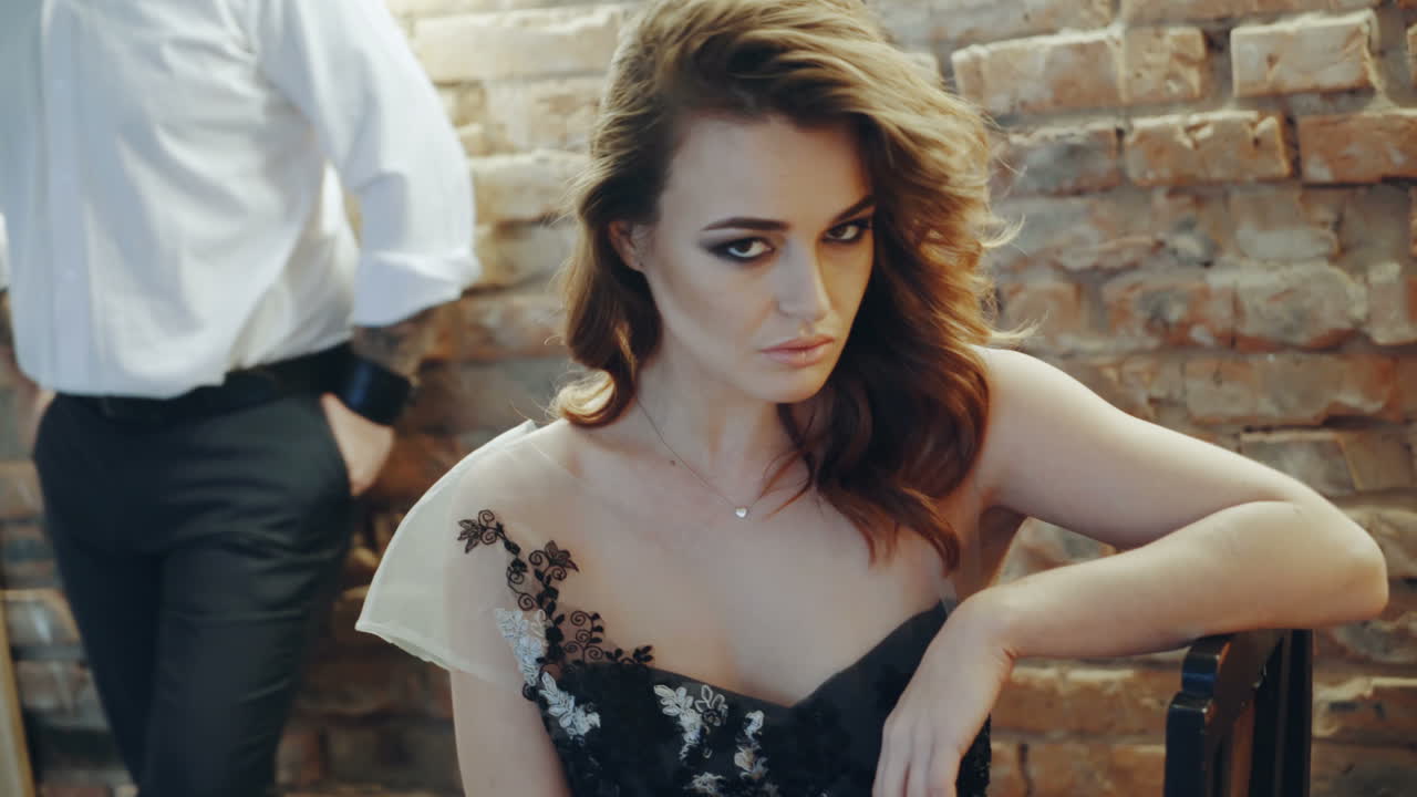 Couple in the restaurant. Young woman with her man sitting in the restaurant