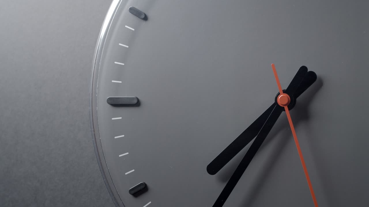 Clock Face in Time lapse from 8 to 10 o'clock on grey wall