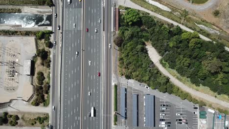 top down pan up view of highway traffic on 101 roof top solar panels pan handle garden moving hold