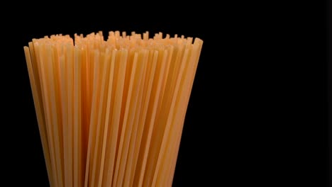 spaghetti rotating on black background