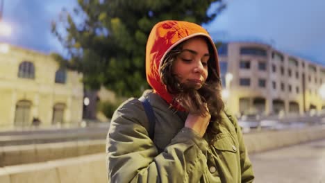 young woman explores city at dusk, enjoying urban freedom