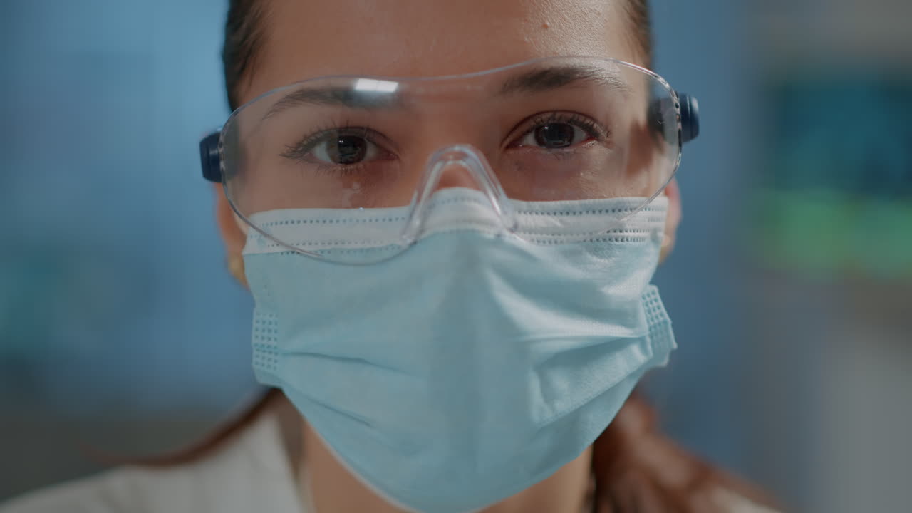 Woman wearing safety glasses during covid 19 pandemic