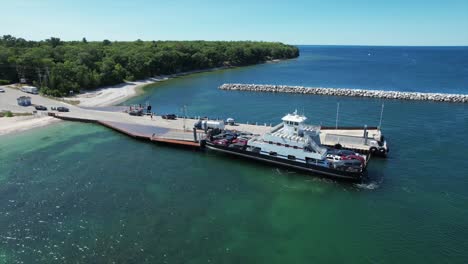 the washington island car ferry arrives at the pier at northport, wisconsin located on the far north shore of the door county peninsula located between lake michigan and the bay of green bay