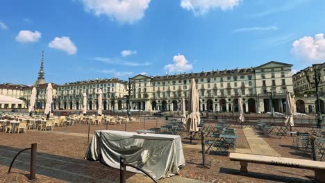 quiet square with historic architecture and tables