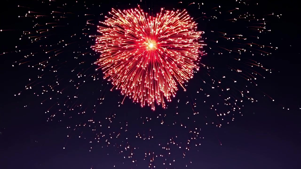Fuochi d'artificio rossi a forma di cuore che esplodono nel cielo notturno