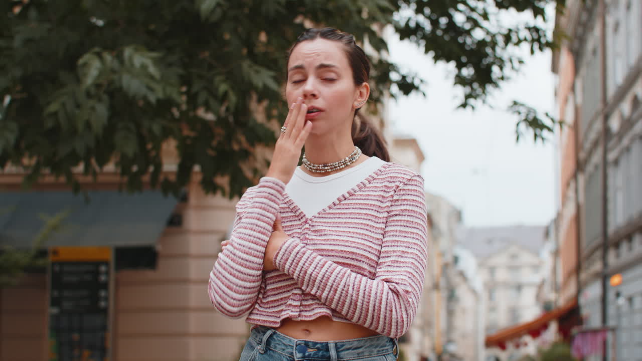 Sad unhappy frustrated woman girl walking alone in city street feeling bad annoyed grief problem