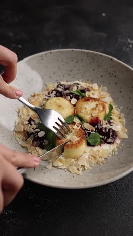 woman eating syrniki