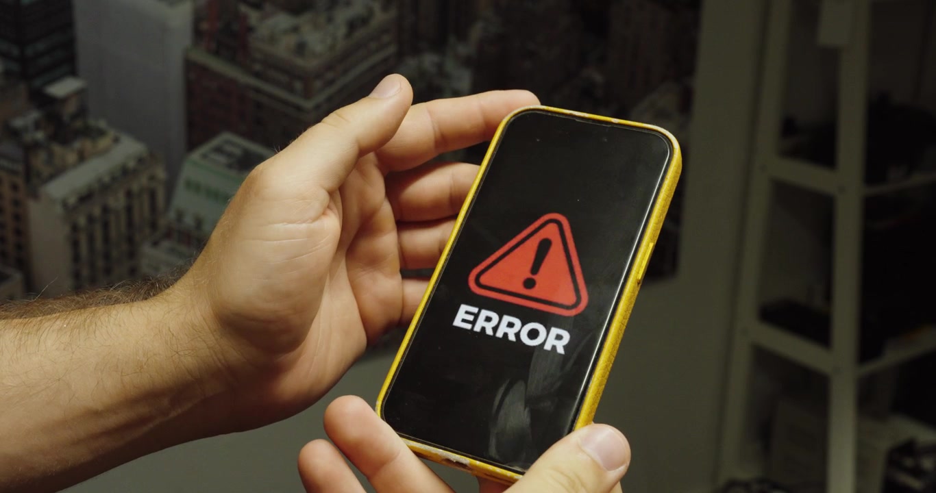 Close-up of a smartphone displaying an error message. Ideal for technology, software issues, troubleshooting, and digital problem concepts.
