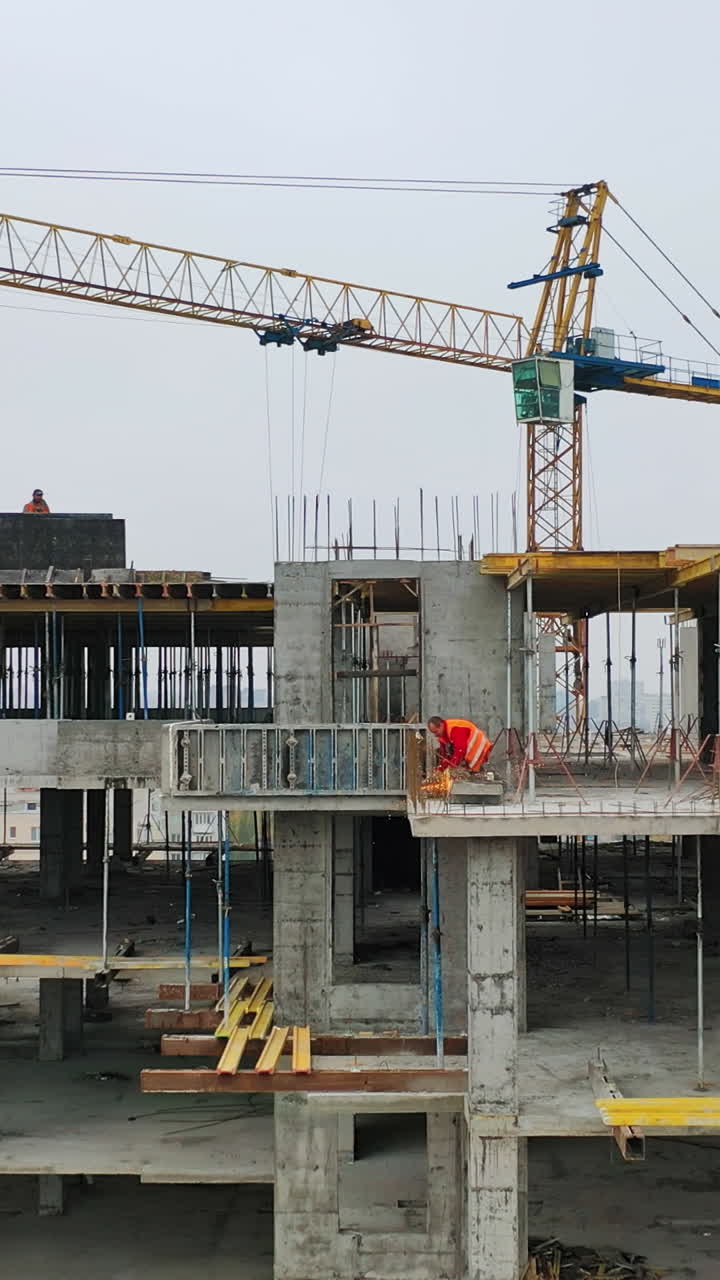 Construction of a residential apartment complex. Aerial view. Vertical video