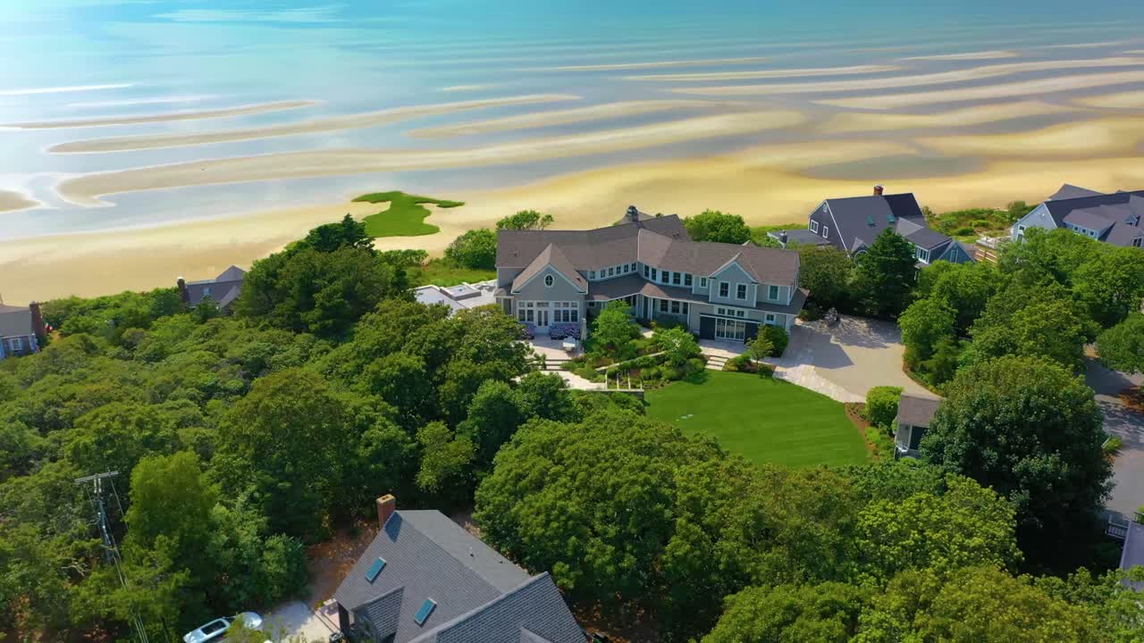 Aerial view of a beautiful house by the beach