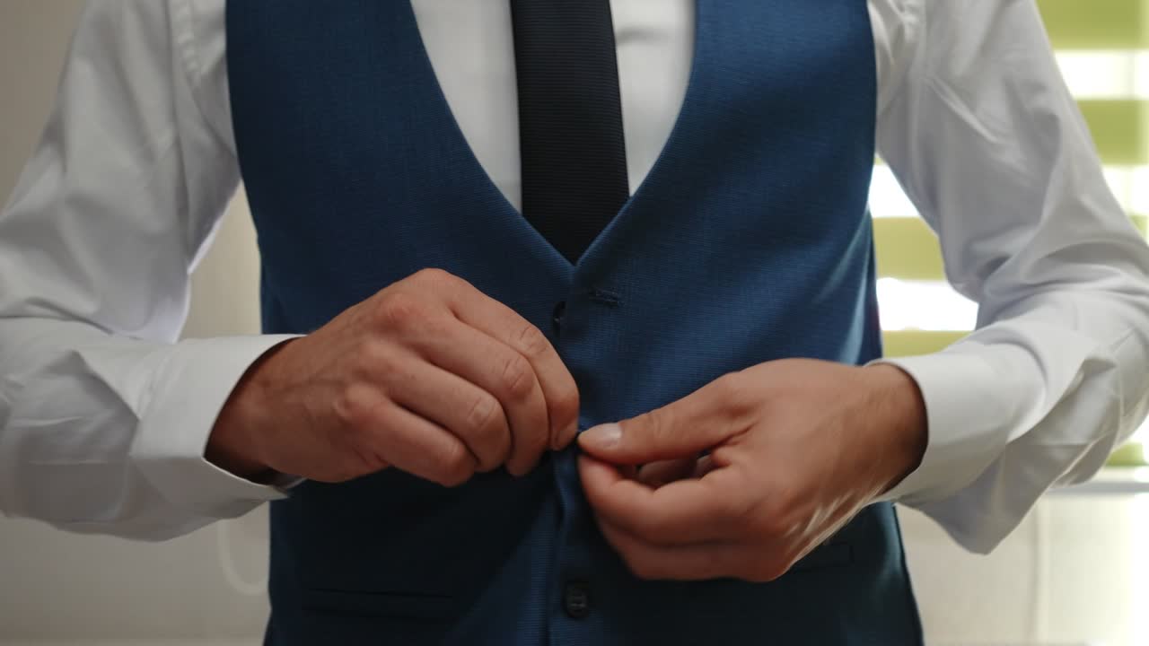 groom's preparing himself for wedding