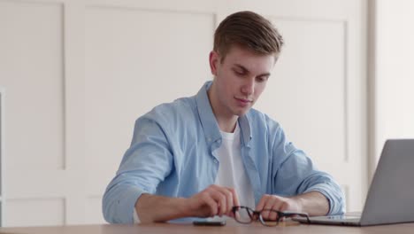 man relaxing at his desk