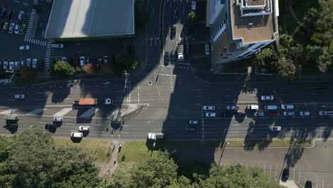 cars passing the busy highway and t intersection