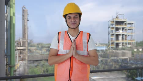 happy indian construction labour doing namaste