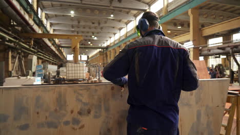 worker in a factory working with wood