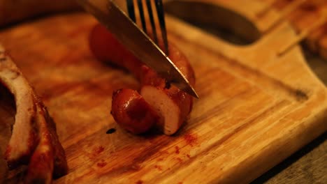 sequential cutting of sausage with a fork and knife