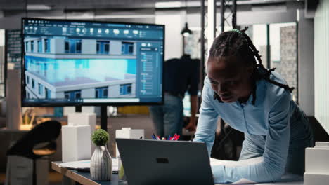 African american contractor reviewing architectural 3D models for the future