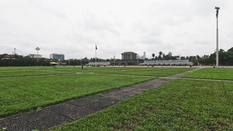 person walking steadily through a grassy field