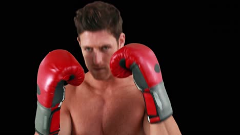 fit man boxing with gloves