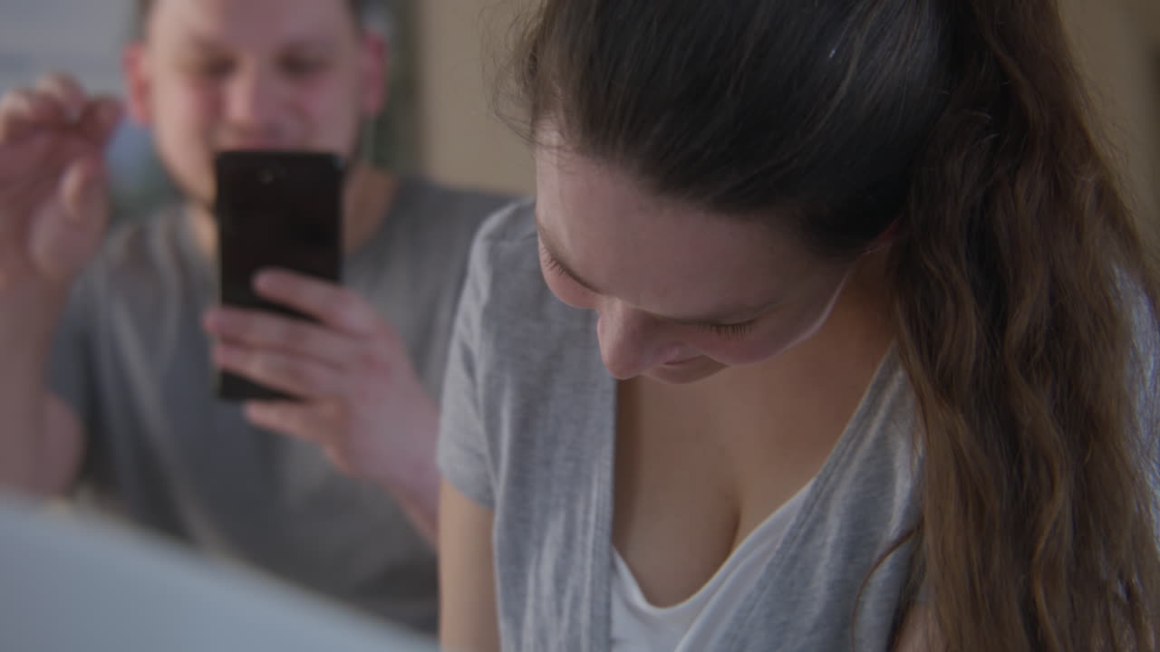 Couple interacting with a smartphone