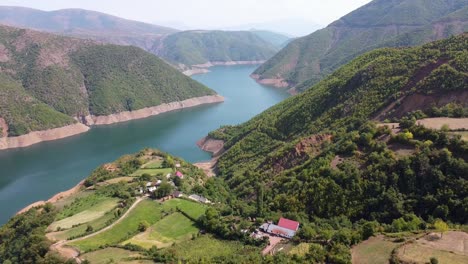 Drin-River-and-Valley-at-Fierze-,-Albania---Reversing-Aerial