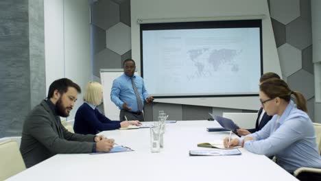 african american man giving business presentation