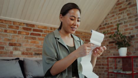 woman reviewing documents/images at home