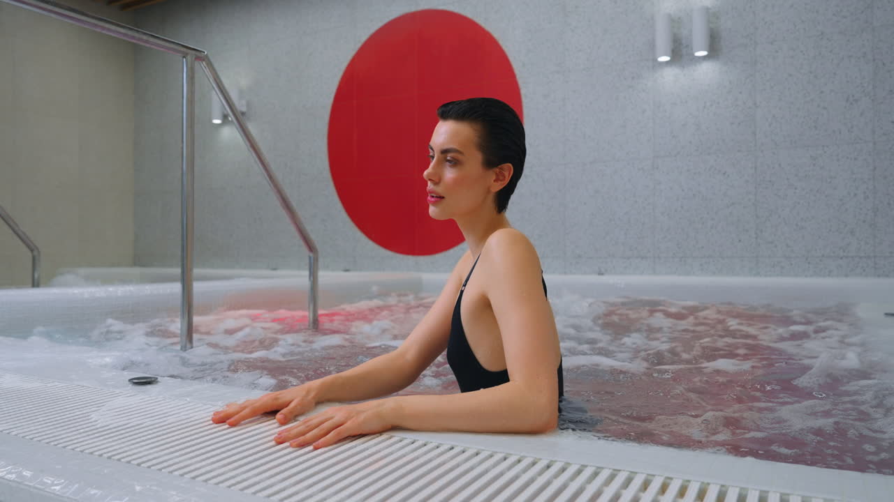 Woman Relaxing in a Modern Spa Hot Tub