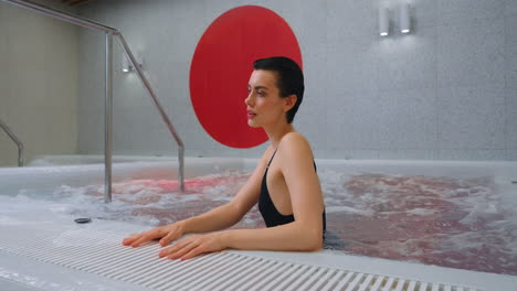 woman relaxing in a modern spa hot tub