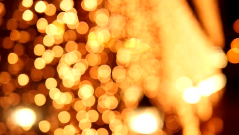 festive blurred golden lights from the street lamps on christmas night on street