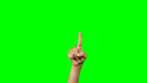 person making hand gesture against green screen background