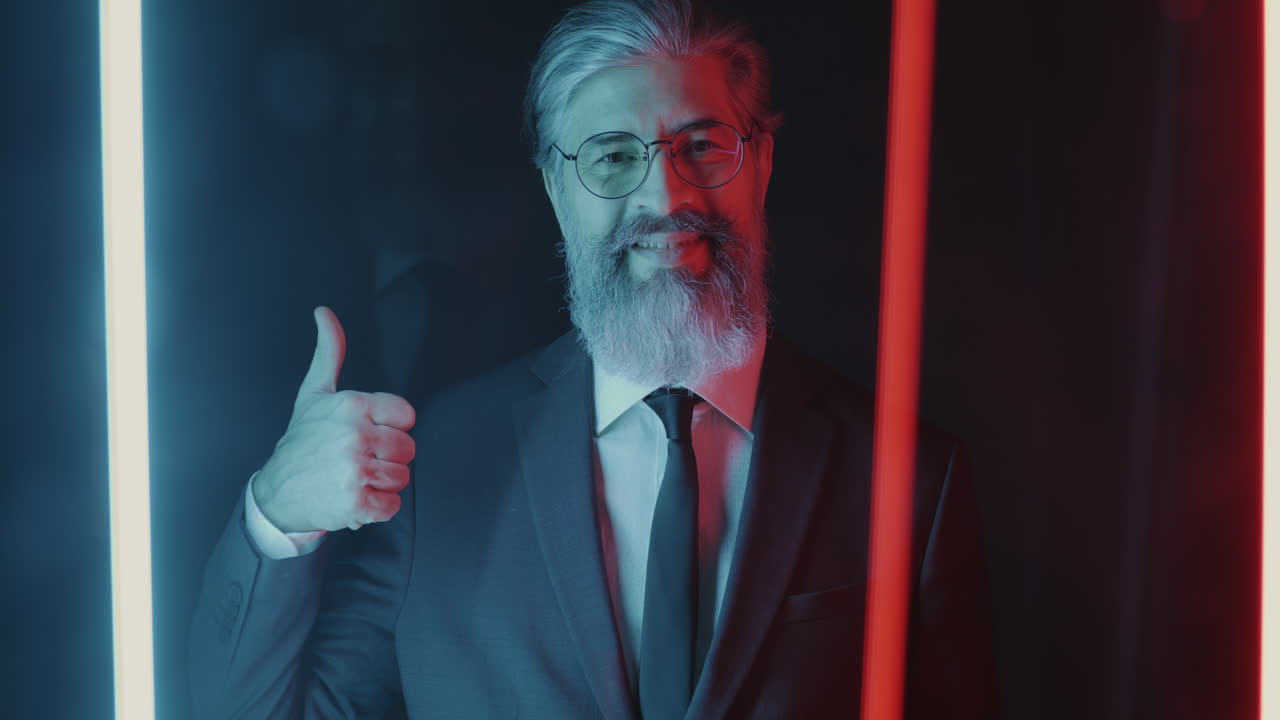 Businessman in a suit with thumbs up gesture and neon lights
